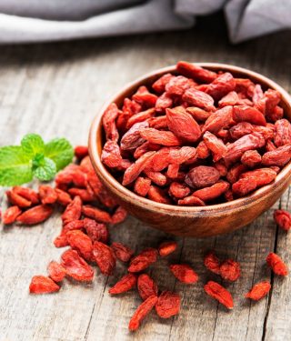dry-red-goji-berries-for-a-healthy-diet-on-a-old-wooden-background_t20_YN318W