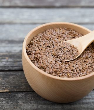 flax-seeds-in-bowl-and-spoon-on-dark-wooden-background-organic-food-concept-selective-focus-copy_t20_b66wZk